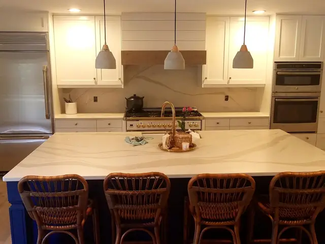 White shaker kitchen with a navy blue island