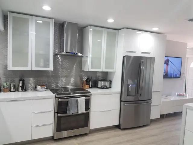 White kitchen with glass-front cabinets