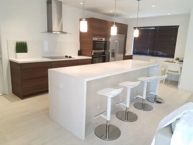 Dark wood kitchen with a white island