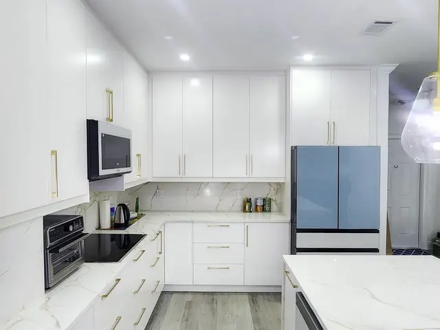 White kitchen with a marble backsplash
