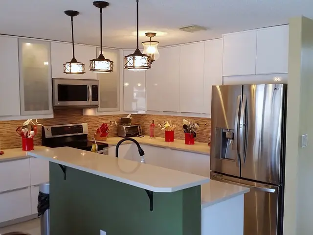 White kitchen with a green island
